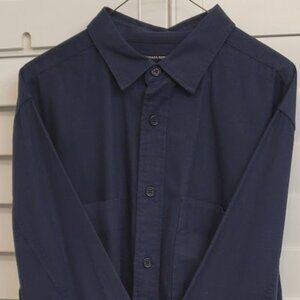 Men's blue long sleeve button down flannel shirt.
